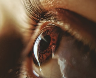 persons eye in close up photography