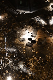 A beautifully designed paver patio with cozy seating and ambient lighting at dusk.