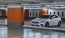 white bmw m 3 parked in garage