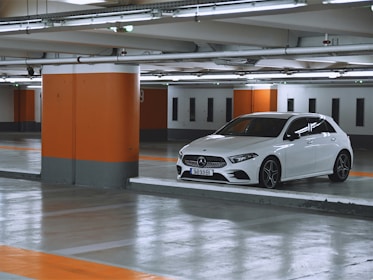 white bmw m 3 parked in garage
