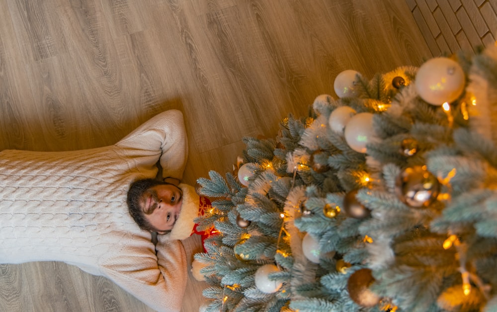 woman in white long sleeve shirt lying on bed