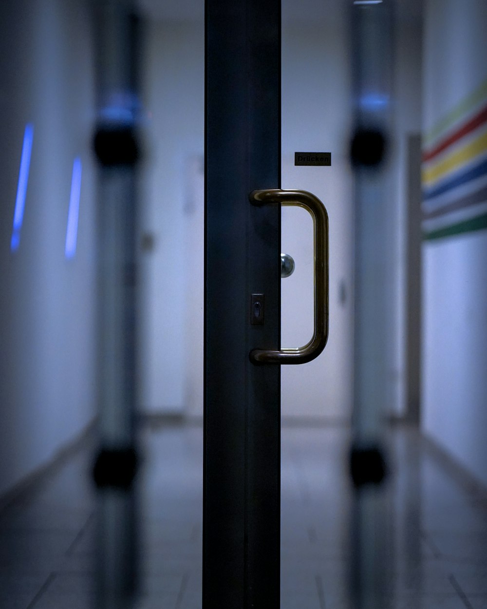 black metal door lever in close up photography