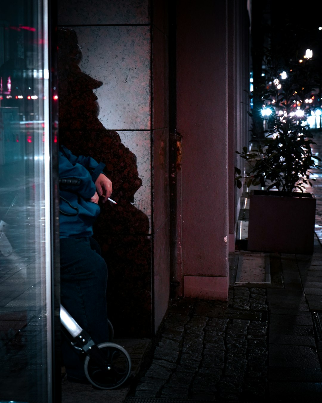 woman in black jacket standing near glass door