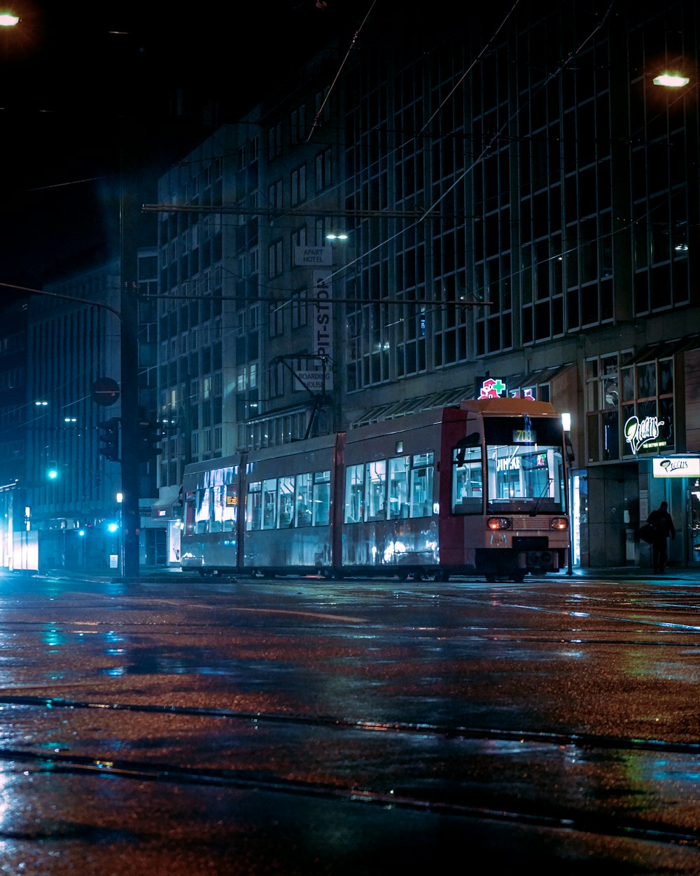 red double decker bus on road during night time