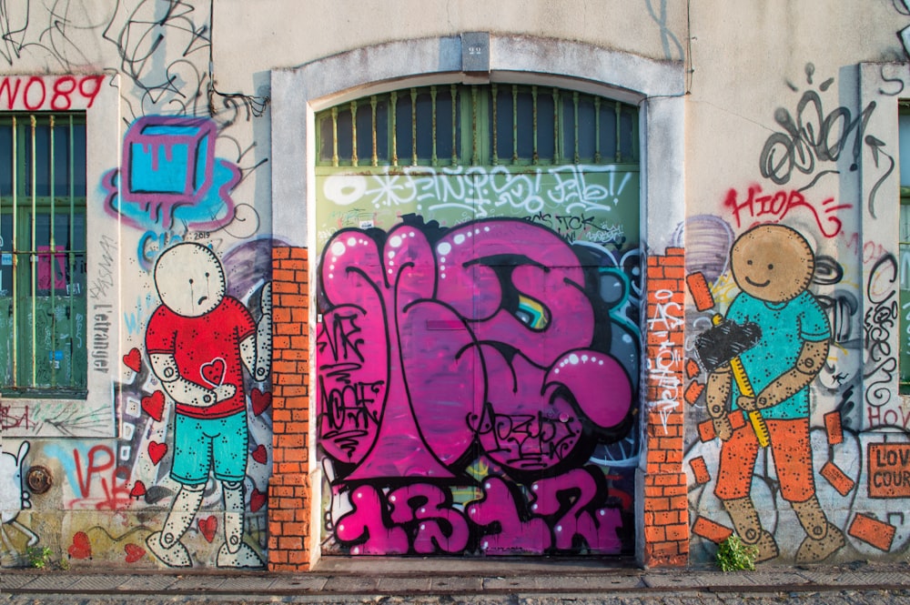 purple and blue graffiti on wall