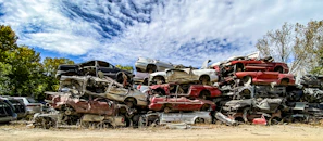 Stacks of crushed metal ready for recycling, showcasing the eco-friendly side of our salvage yard.