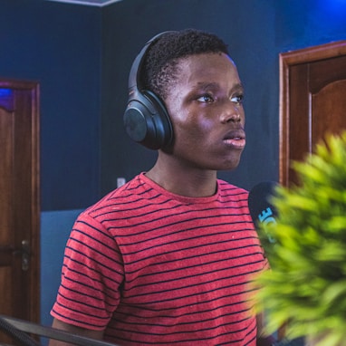 man in red and black striped crew neck shirt wearing headphones