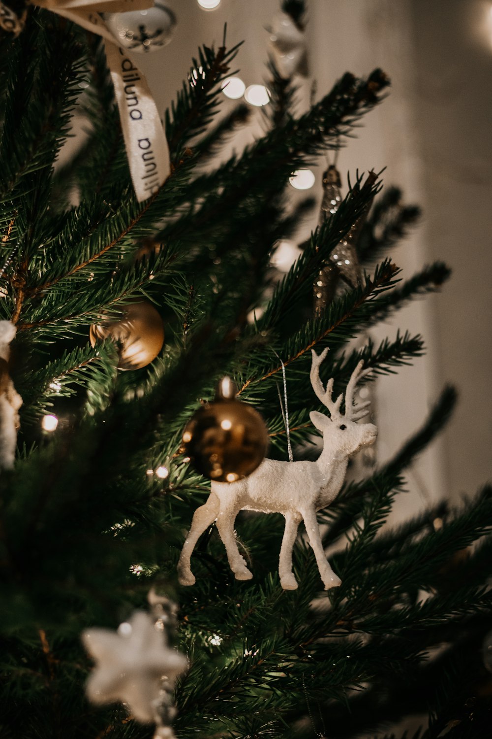 white angel figurine on christmas tree