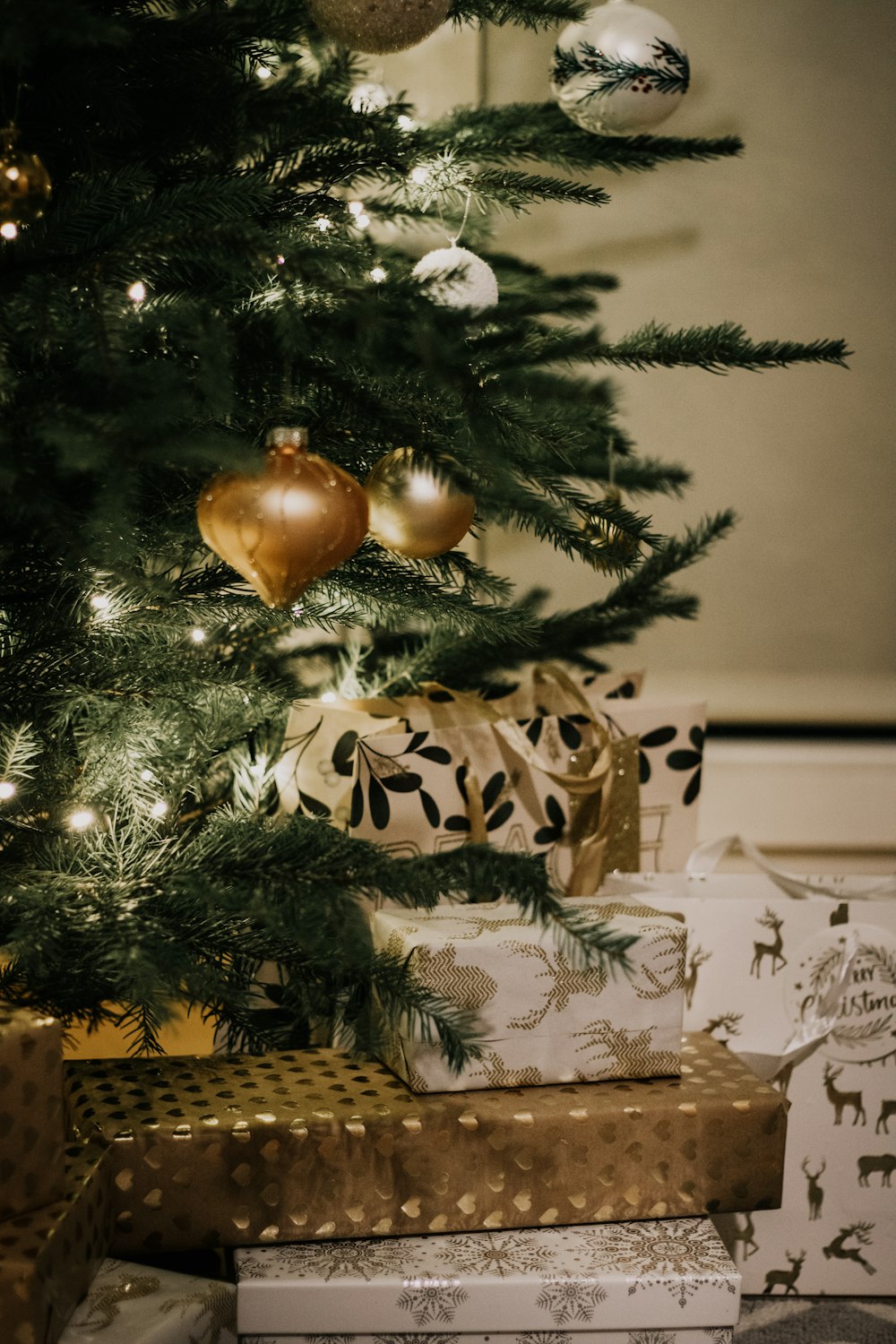 gold bauble on green christmas tree