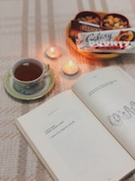 An inviting tray with a variety of teas and a handwritten journal open to notes.