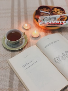 An inviting tray with a variety of teas and a handwritten journal open to notes.