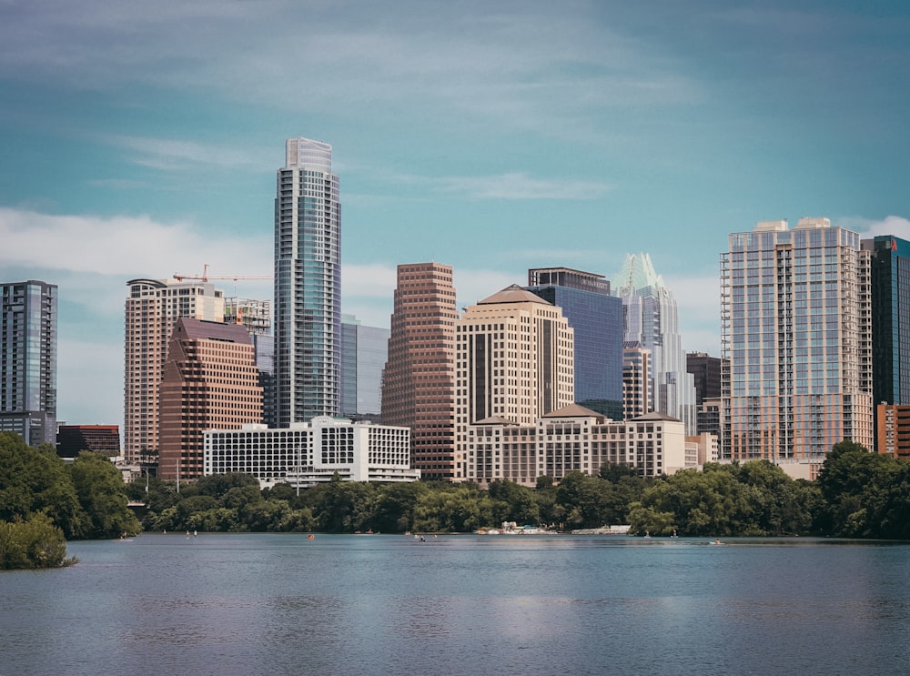 city skyline across body of water during daytime