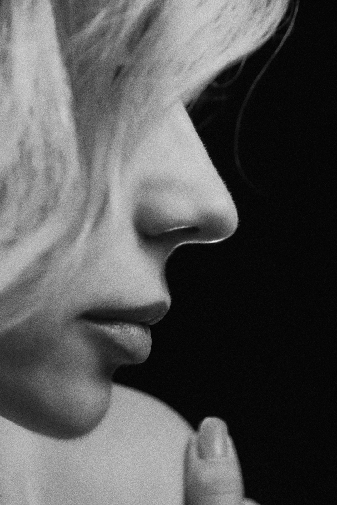 womans face in grayscale