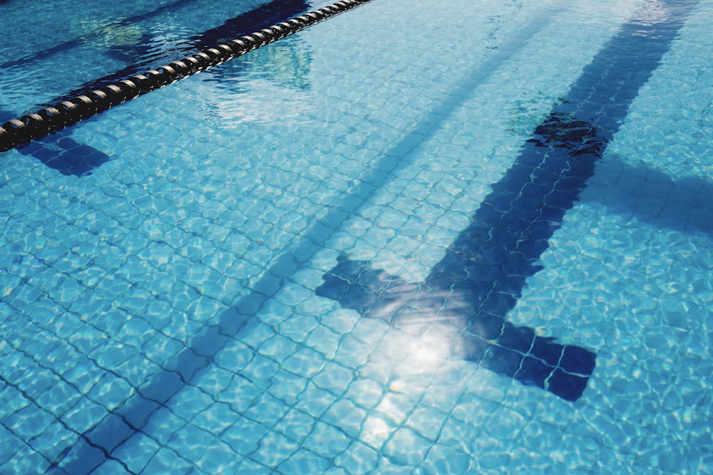 person in swimming pool during daytime