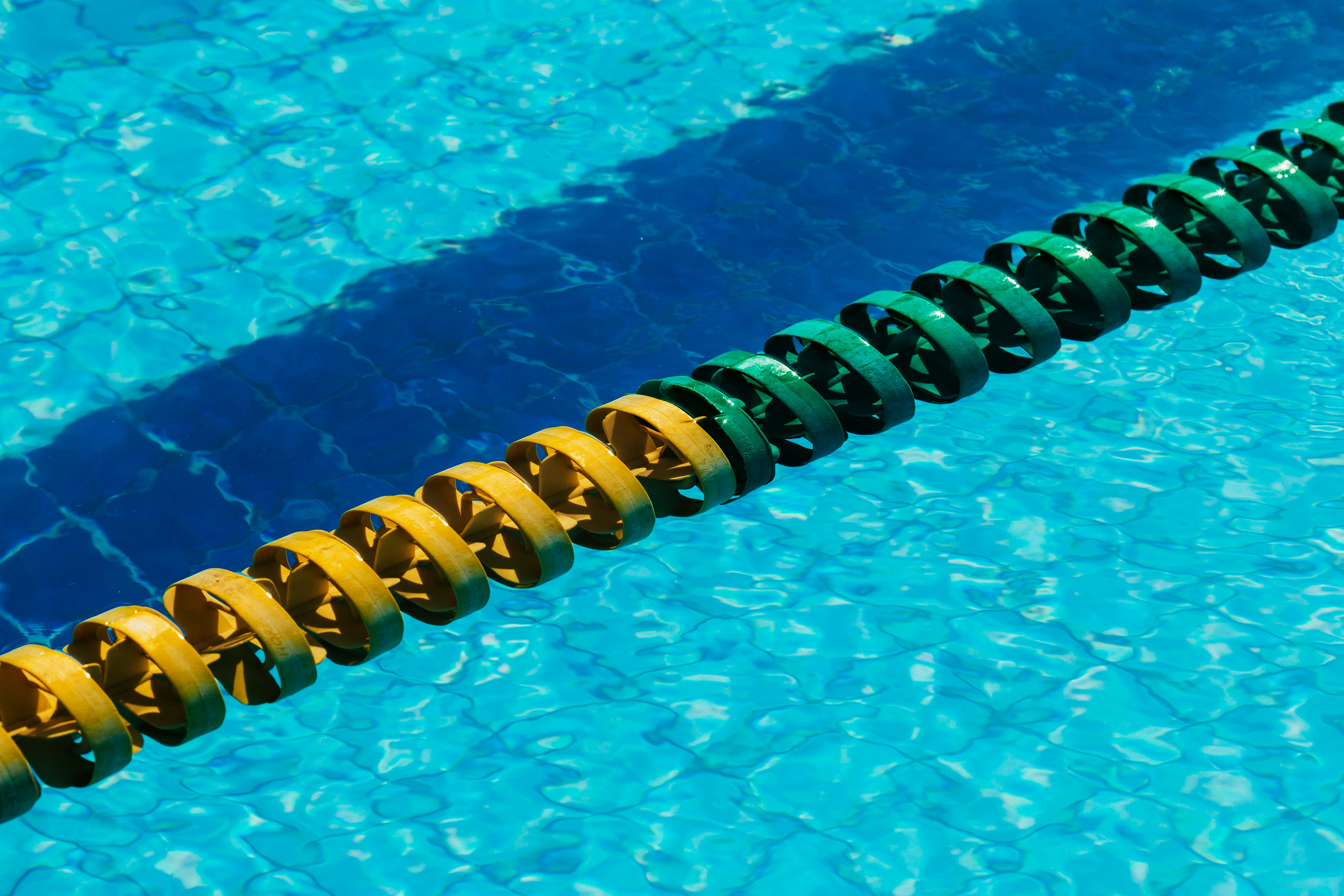 yellow and blue rubber band on swimming pool