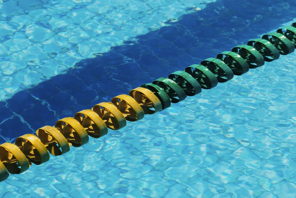 yellow and blue rubber band on swimming pool
