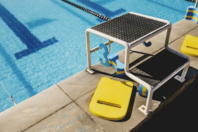 white and blue swimming pool chair