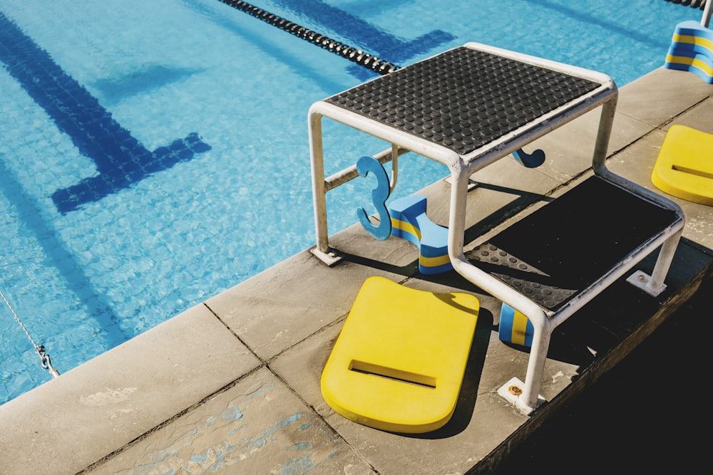 white and blue swimming pool chair