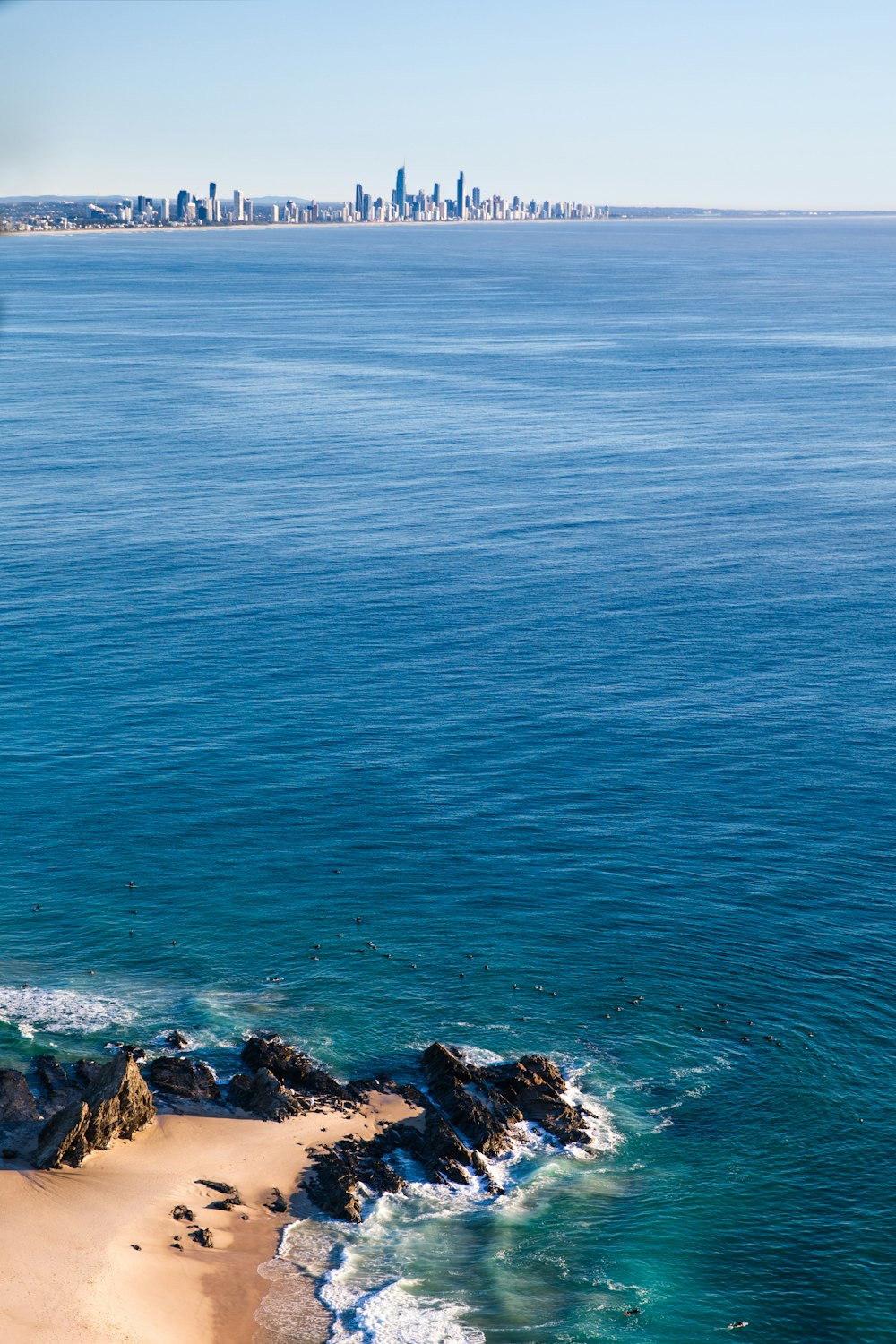 brown rocks on sea water during daytime