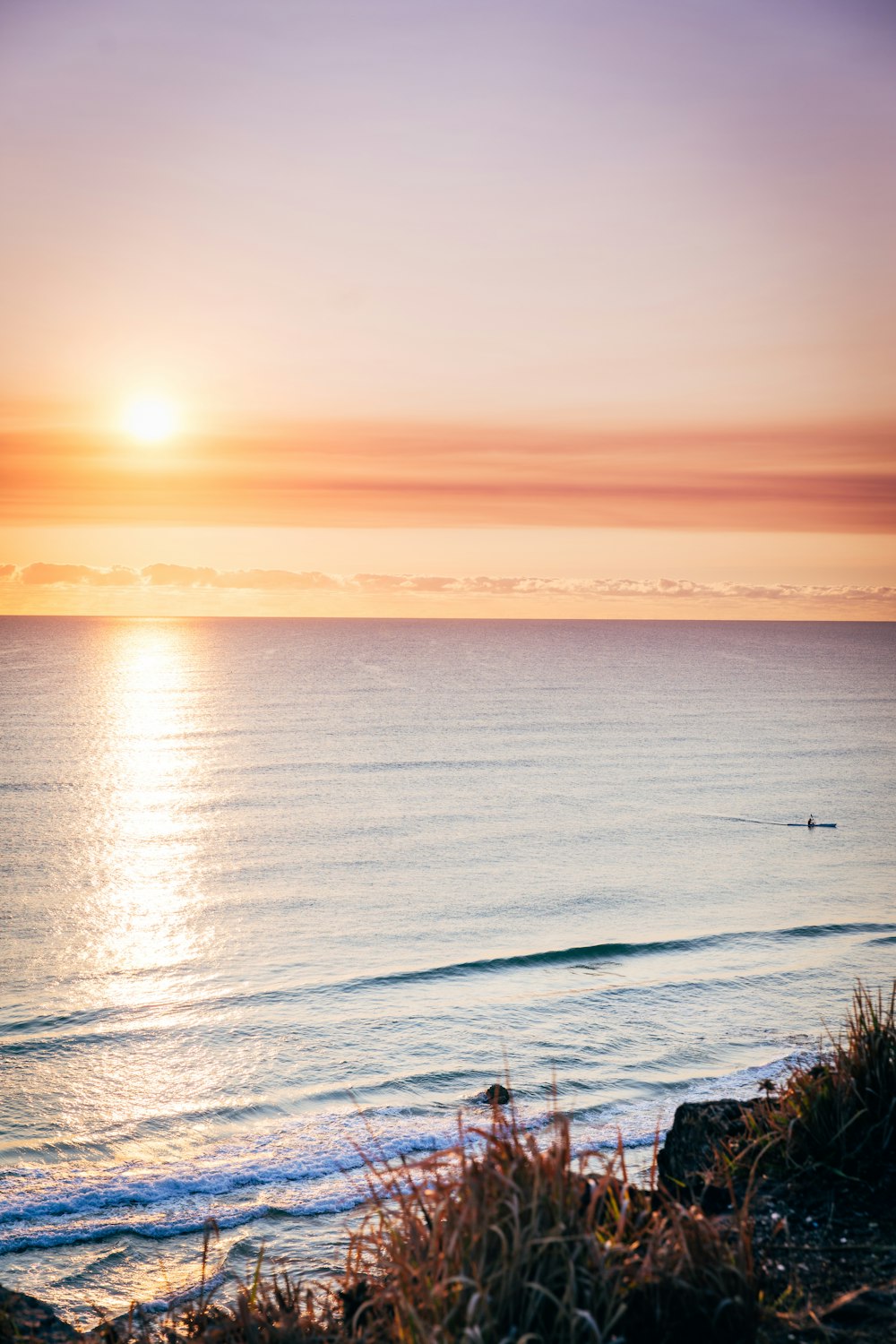 body of water during sunset