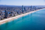 aerial view of city buildings near sea during daytime