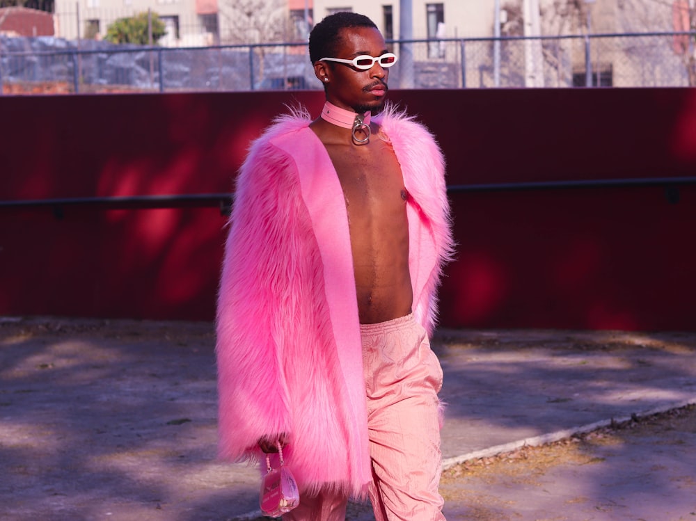 woman in pink scarf and white long sleeve shirt