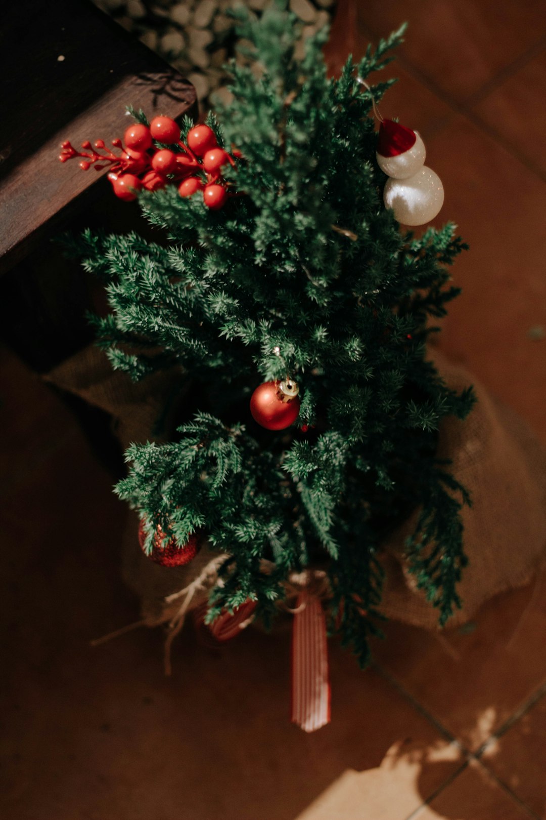 green christmas tree with red and white baubles