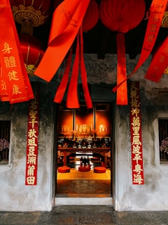 Traditional housewarming ceremony with a decorated altar and family members gathered in festive attire.