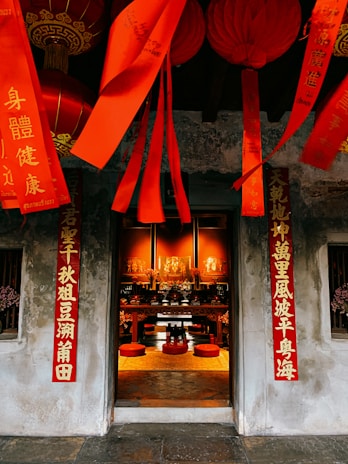 Traditional housewarming ceremony with a decorated altar and family members gathered in festive attire.