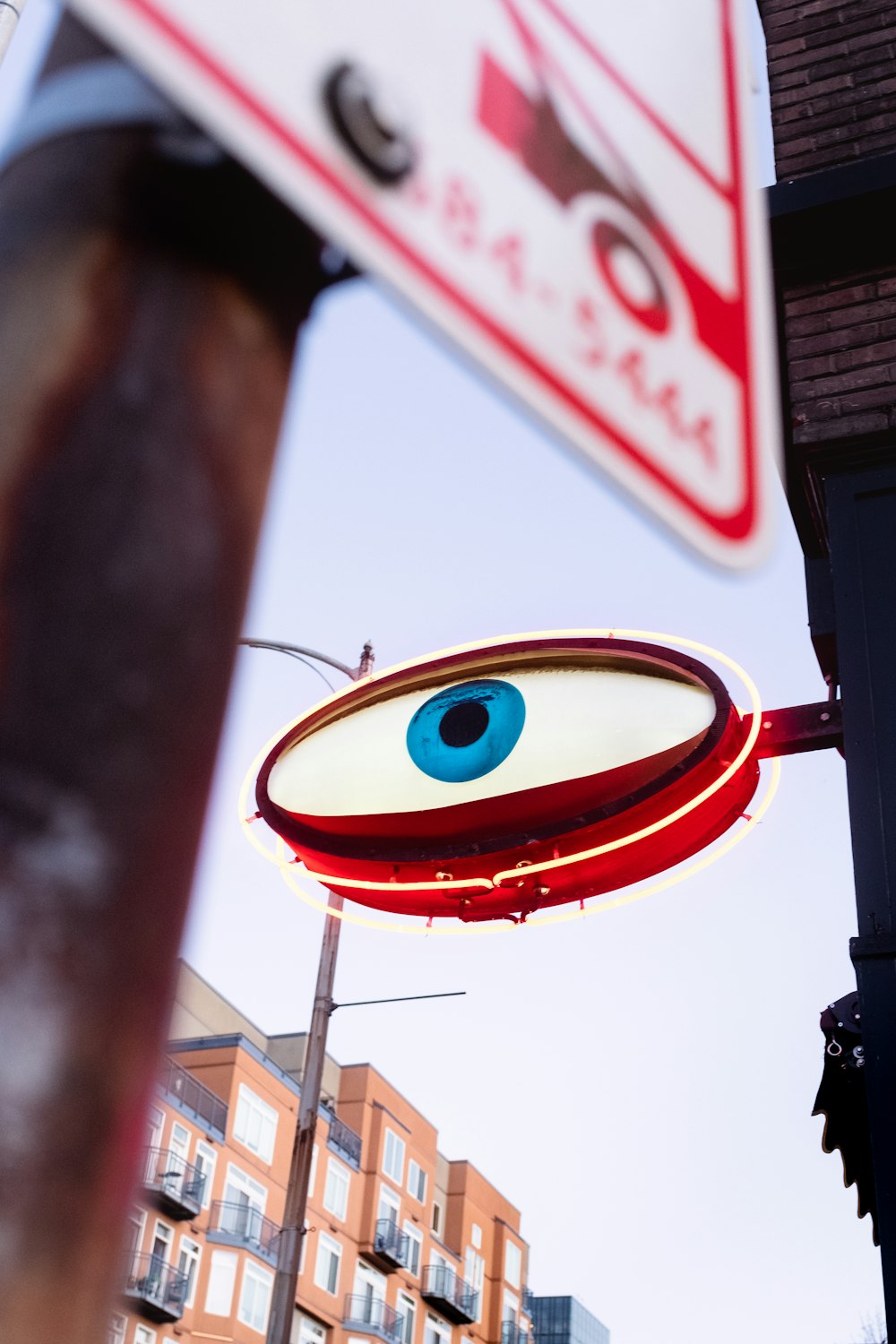 red and blue round signage