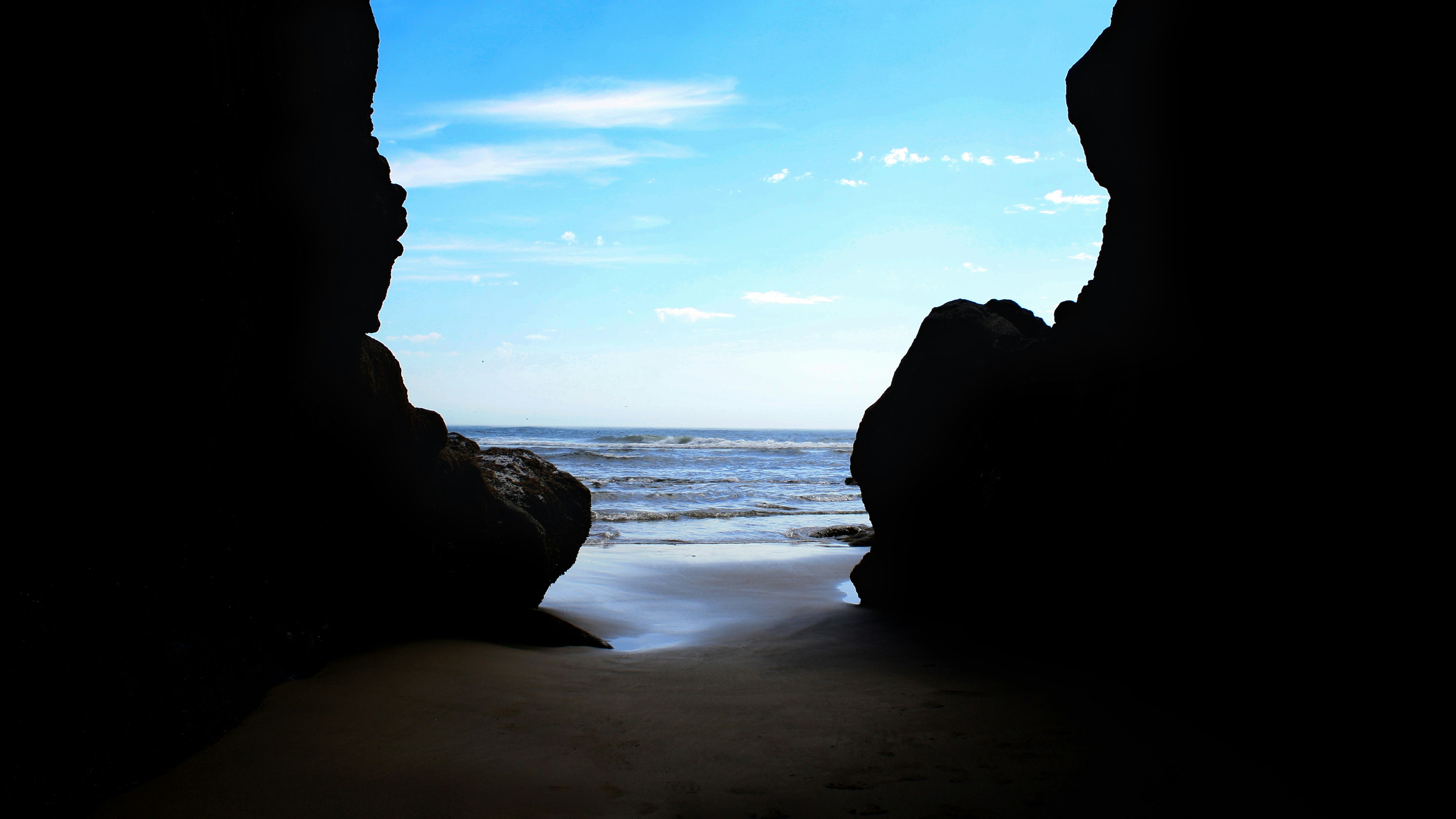 A view of the ocean from inside a cave