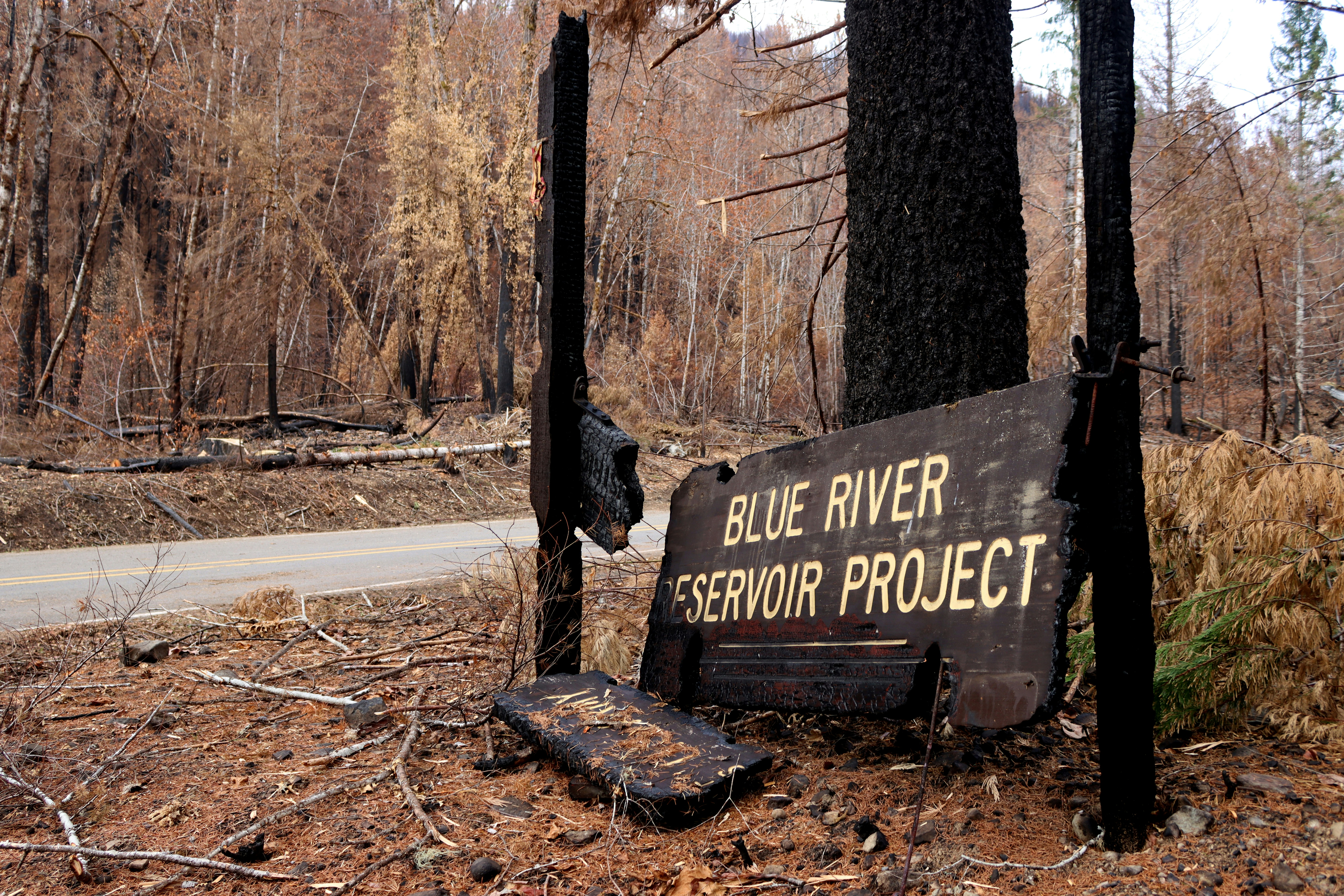 A sign that reads blue river reservoir project