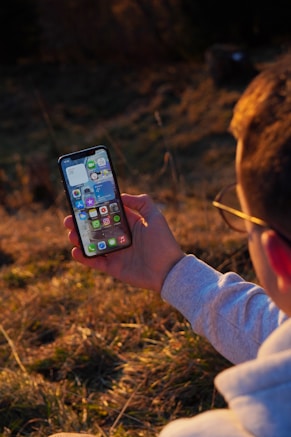 person holding black iphone 5