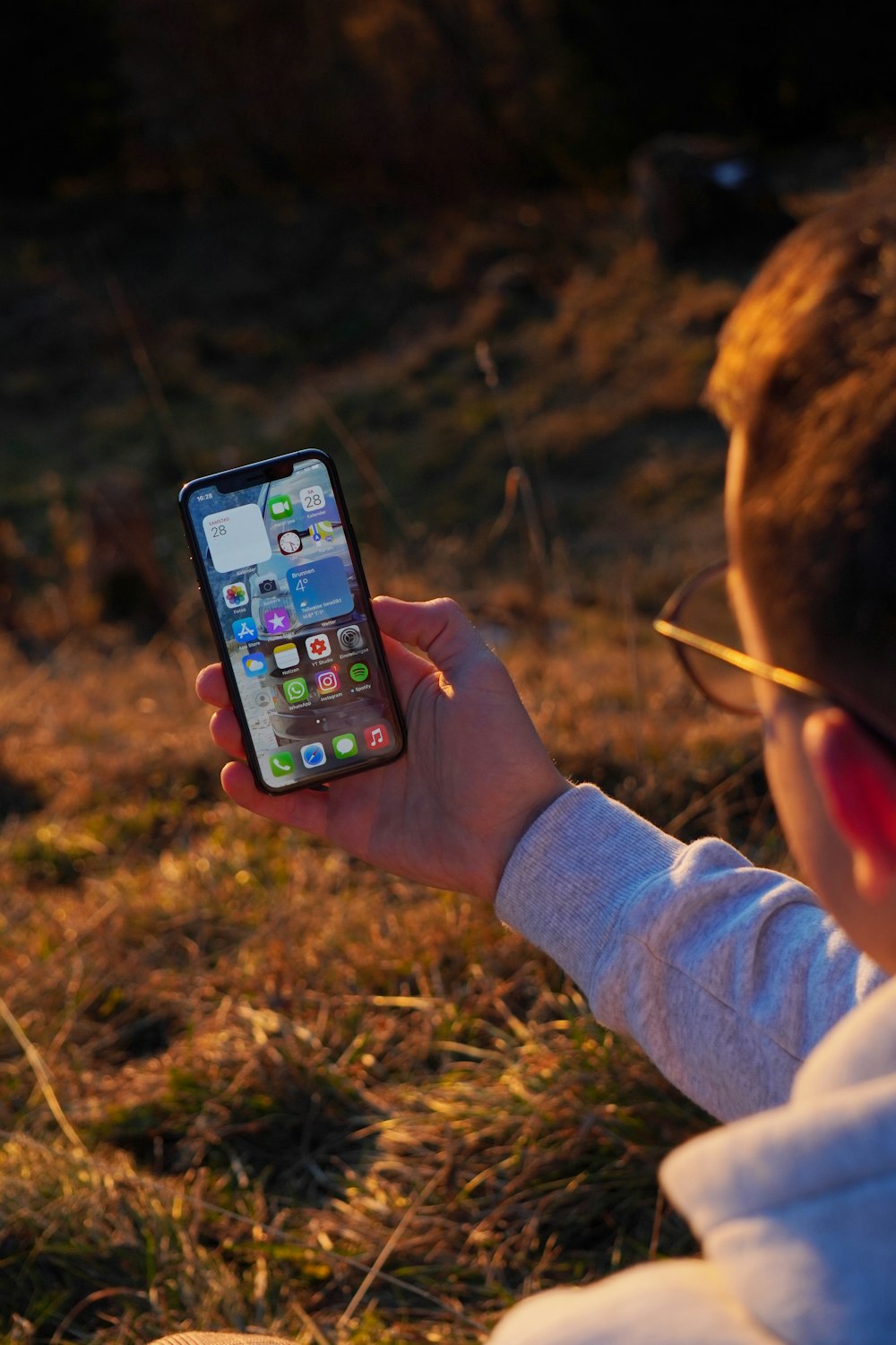 person holding black iphone 5