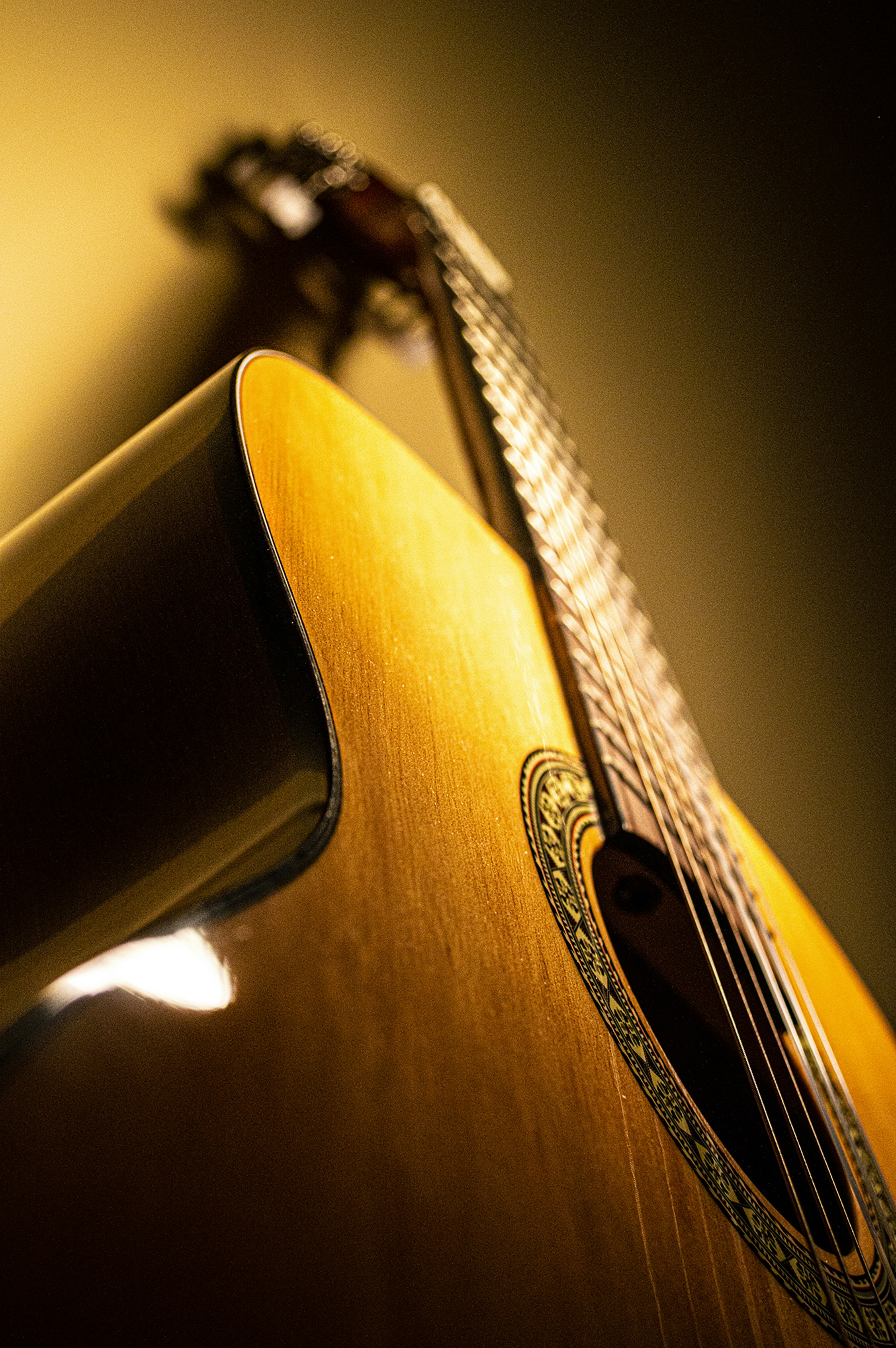 Dark warm-toned music visual with golden light and shadows