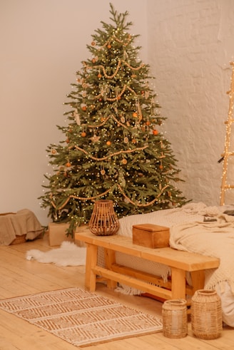 green christmas tree on brown wooden table
