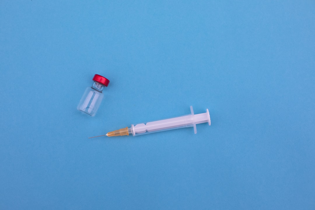 red and white pen on green textile, Ready for the vaccination?