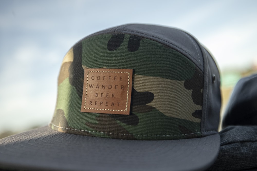 green and brown camouflage cap