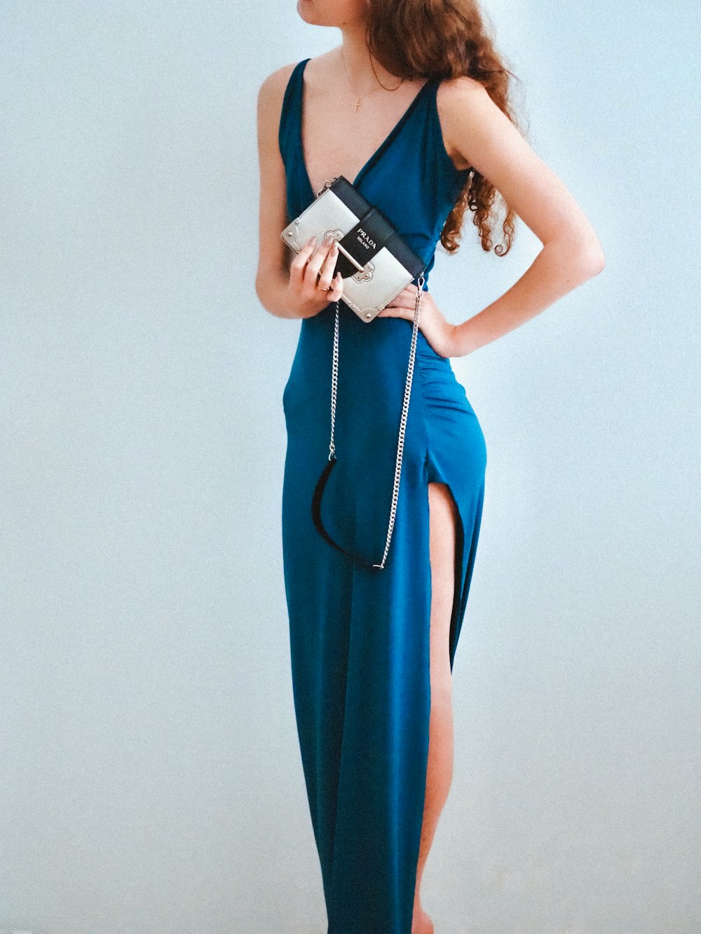 woman in blue sleeveless dress