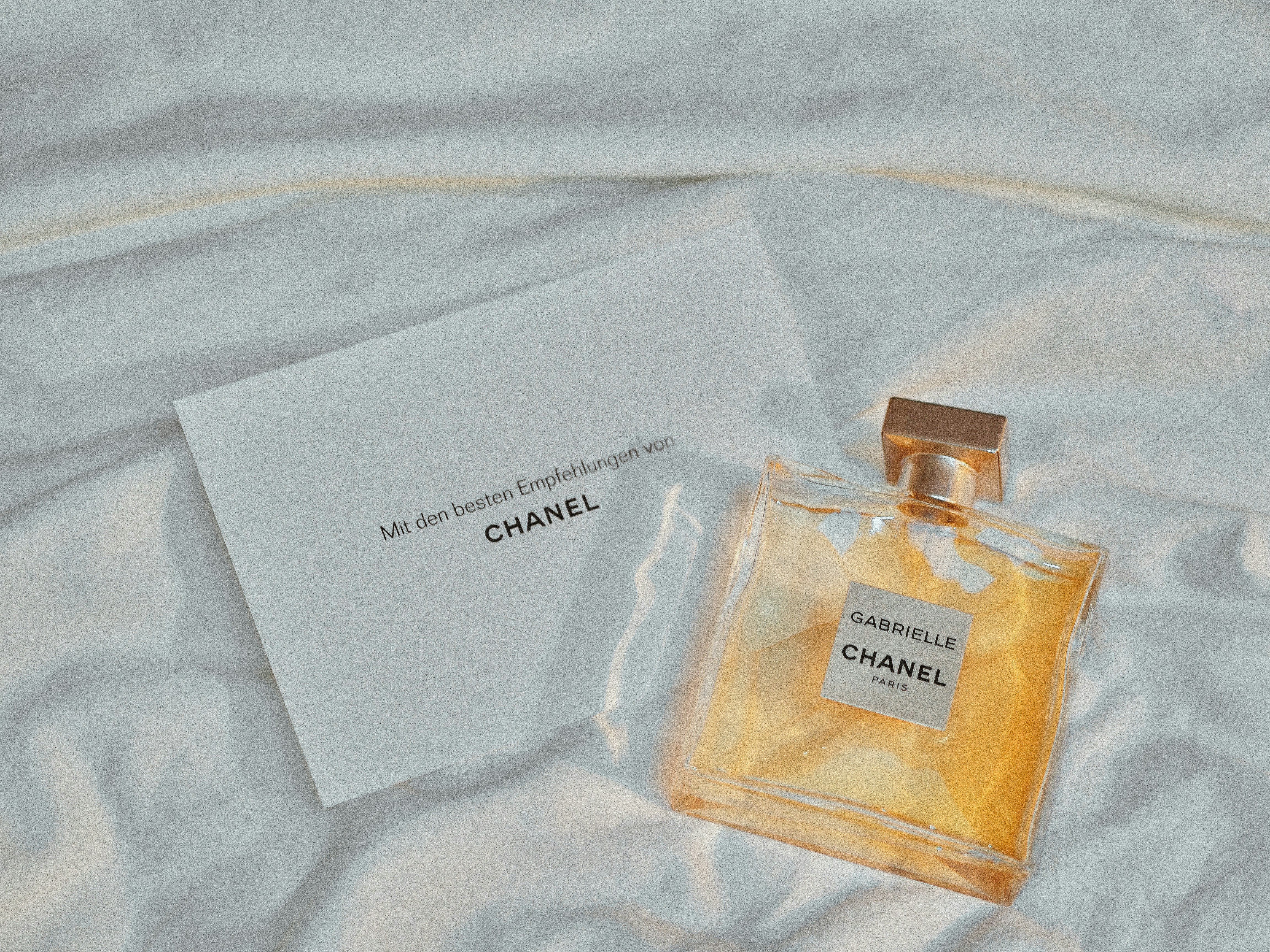 White and gold perfume bottles