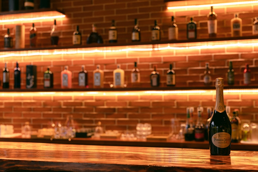 bottles on brown wooden shelf