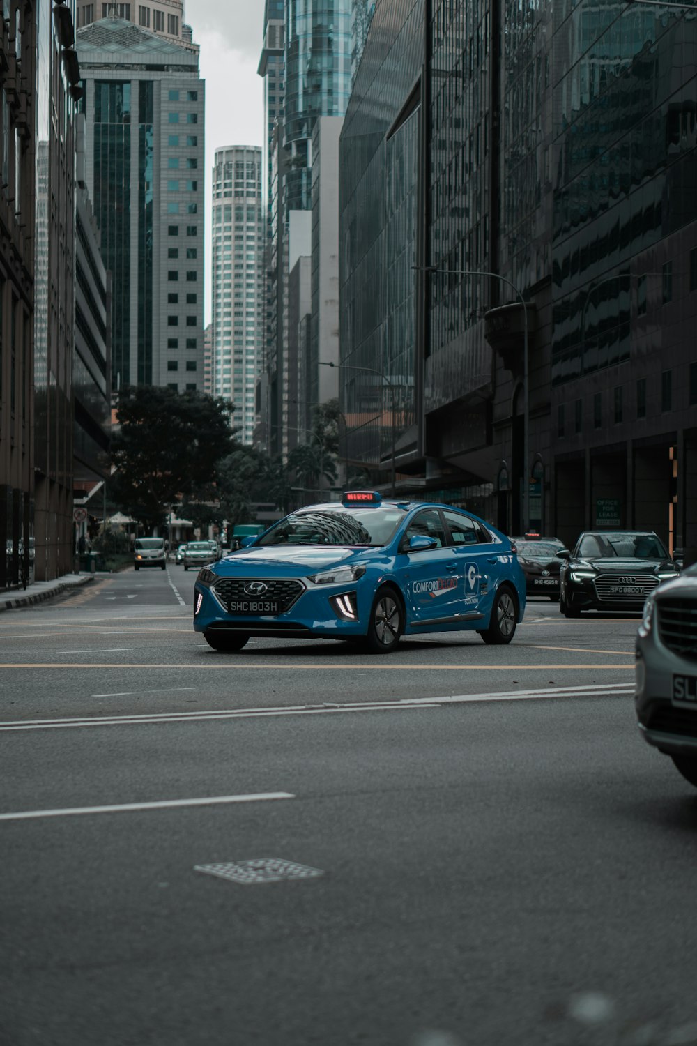 blue audi a 4 on road during daytime