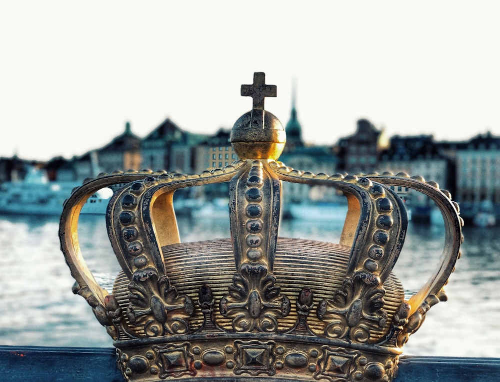 gold crown on blue body of water during daytime