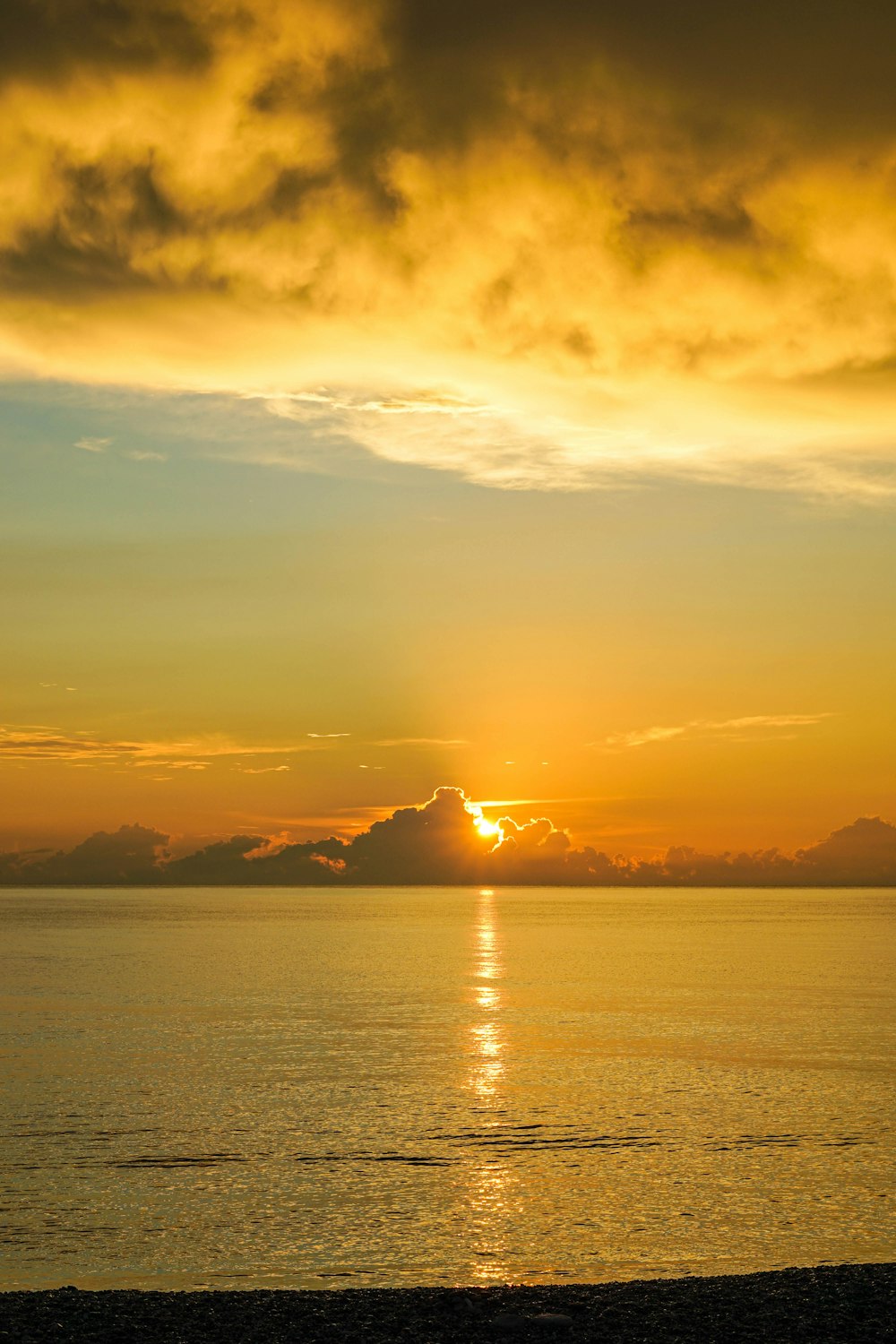 body of water during sunset