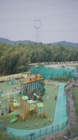 Children enjoying various games with bright, safe equipment in a family-friendly setting.