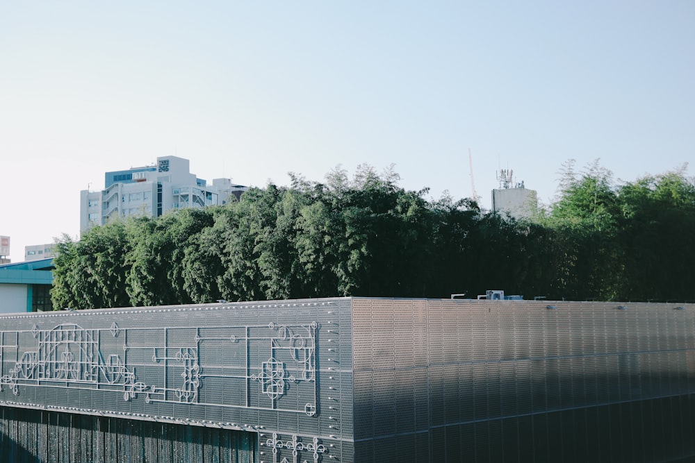 white concrete building near green trees during daytime