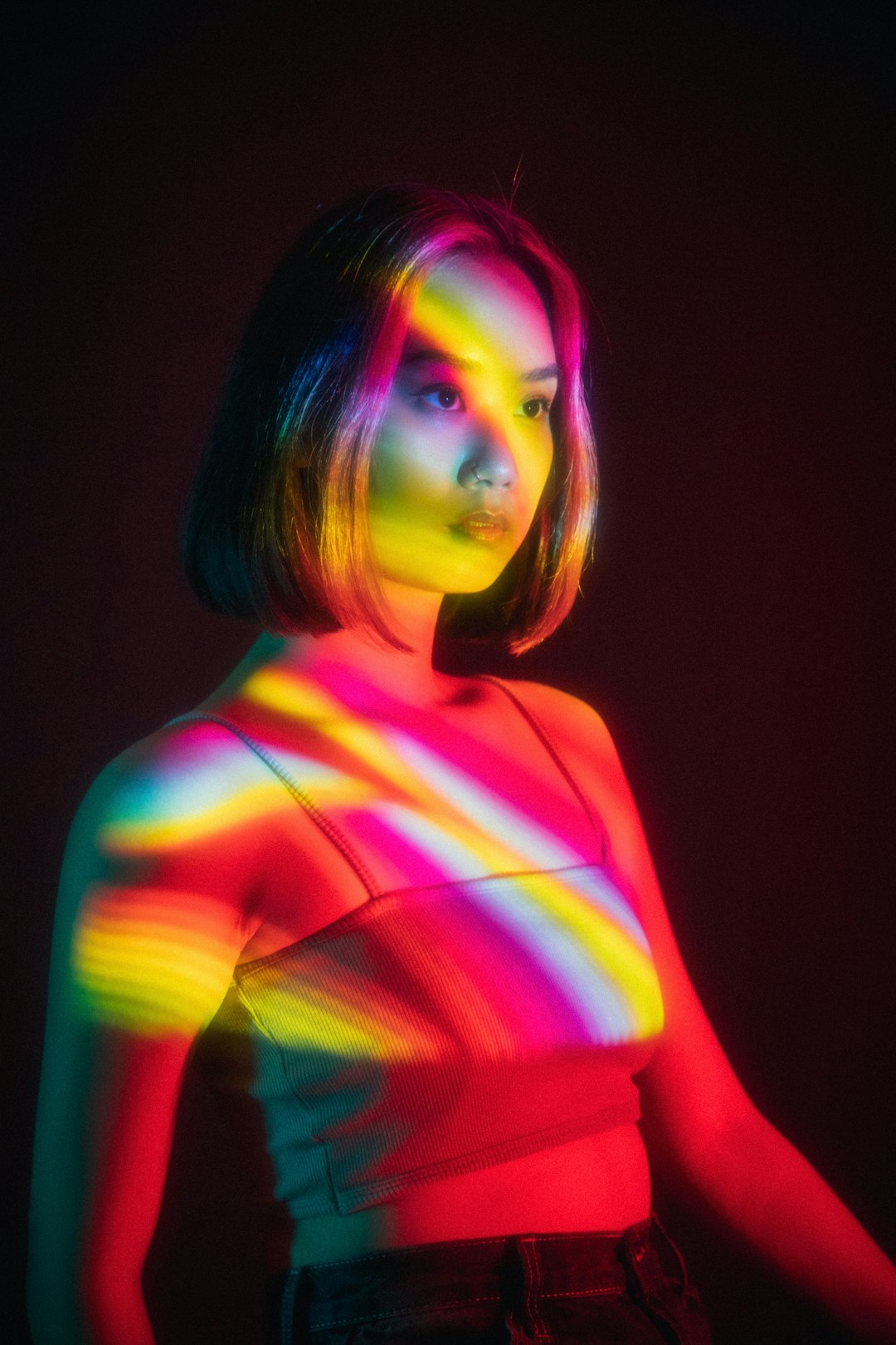 woman in pink green and white striped shirt