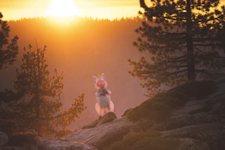 A friendly unicorn standing in a magical forest with simple shapes and thick lines.