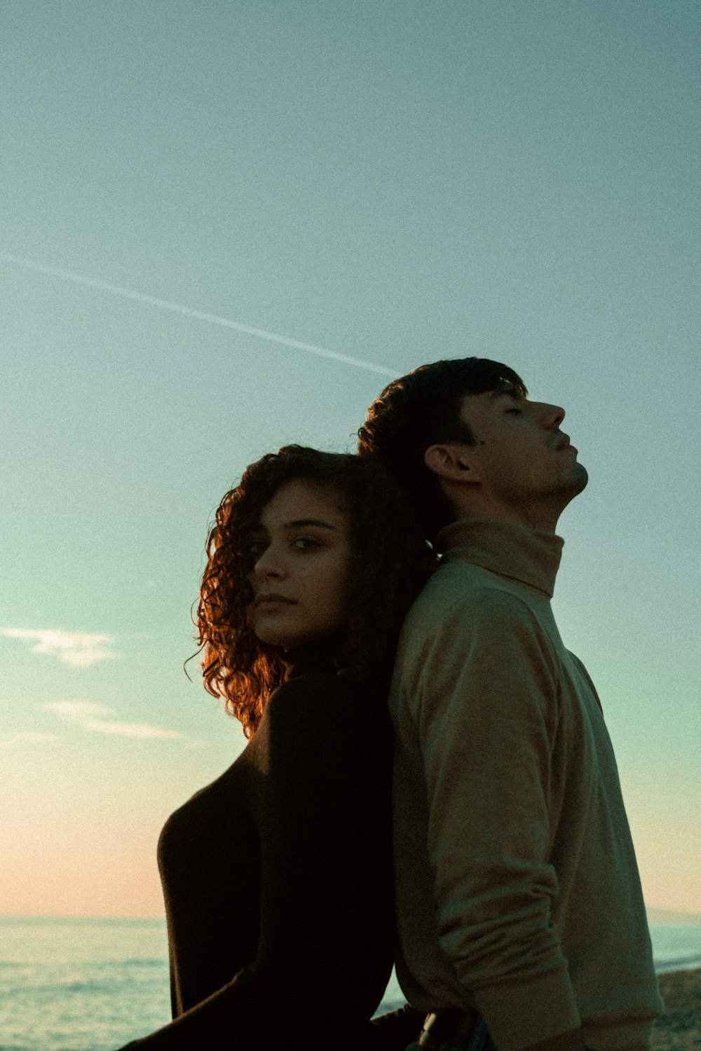 man and woman standing under blue sky during daytime