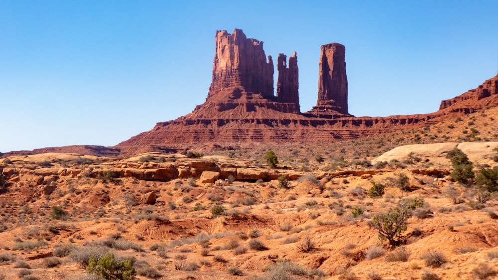 brown rock formation under blue sky during daytime